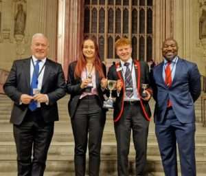 A photo of the winning students with MP Richard Fuller (left) and PCC Festus Akinbusoye (right)
