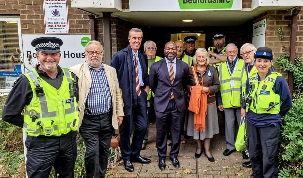 Police and Crime Commissioner Festus Akinbusoye with police officers, local councillors and MP Andrew Selous at Boassard House in Leighton Buzzard